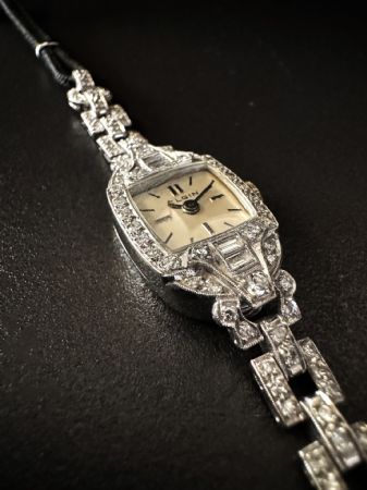 Orologio  -  bracciale  in  platino  con  Diamanti. 1.5  ct.