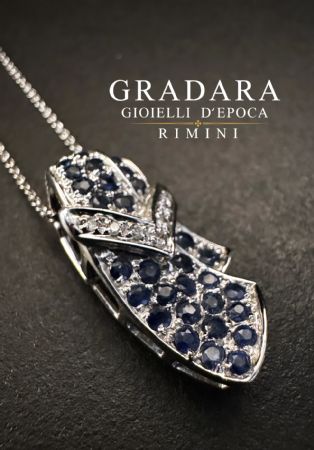 Buckle-shaped pendant with Sapphires and Diamonds